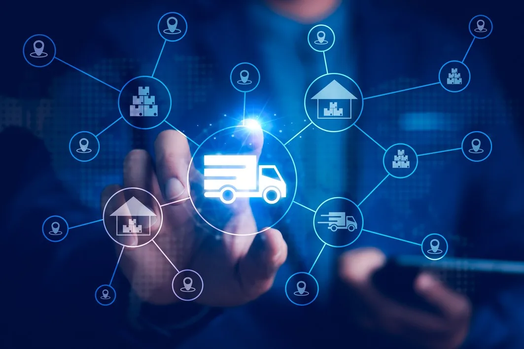 A businessman interacts with a digital ecosystem of truck freight, warehousing, and e-commerce, 