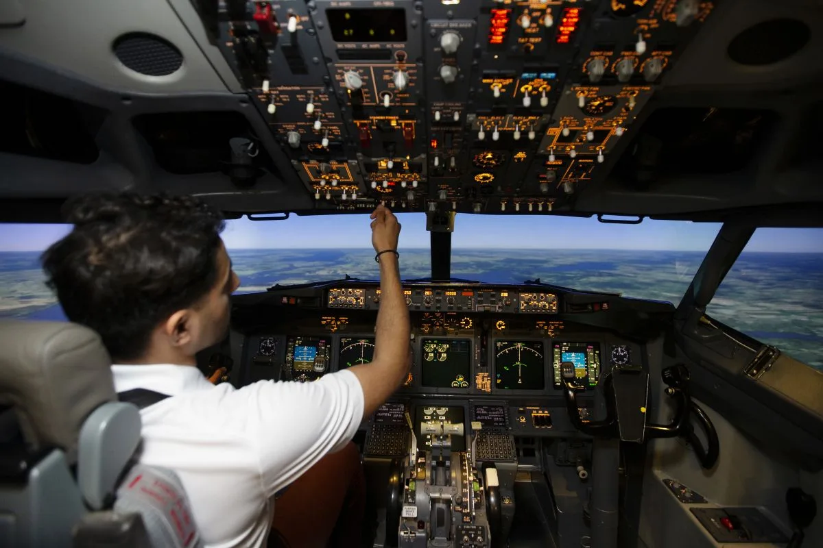 Pilot in plane cockpit bloomberg
