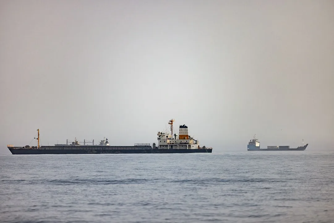 AN OIL TANKER VESSEL AT SEA UNDER A GREY SKY