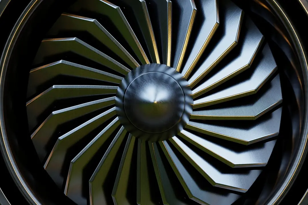 A jet engine turbine seen close-up in a metallic finish.