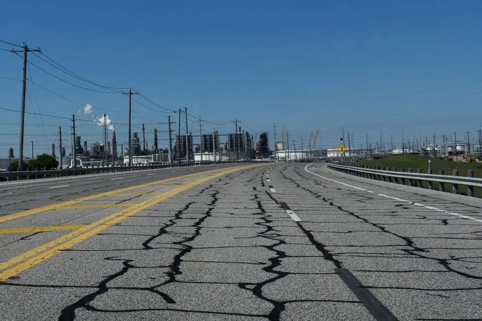 Cracked roadway us infrastructure crumbling istock artistic operations 2277332938
