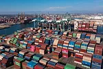 Aerial shot of the Port of San Pedro in Los Angeles CA with San Vicente Bridge in the Long Beach area with shipping containers stuck at harbor.
