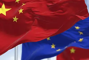 THE FLAGS OF CHINA AND THE EU FLY FROM POLES