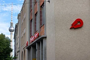 AN OFFICE BUILDING BEARS THE RED WORDS DELIVERY HERO