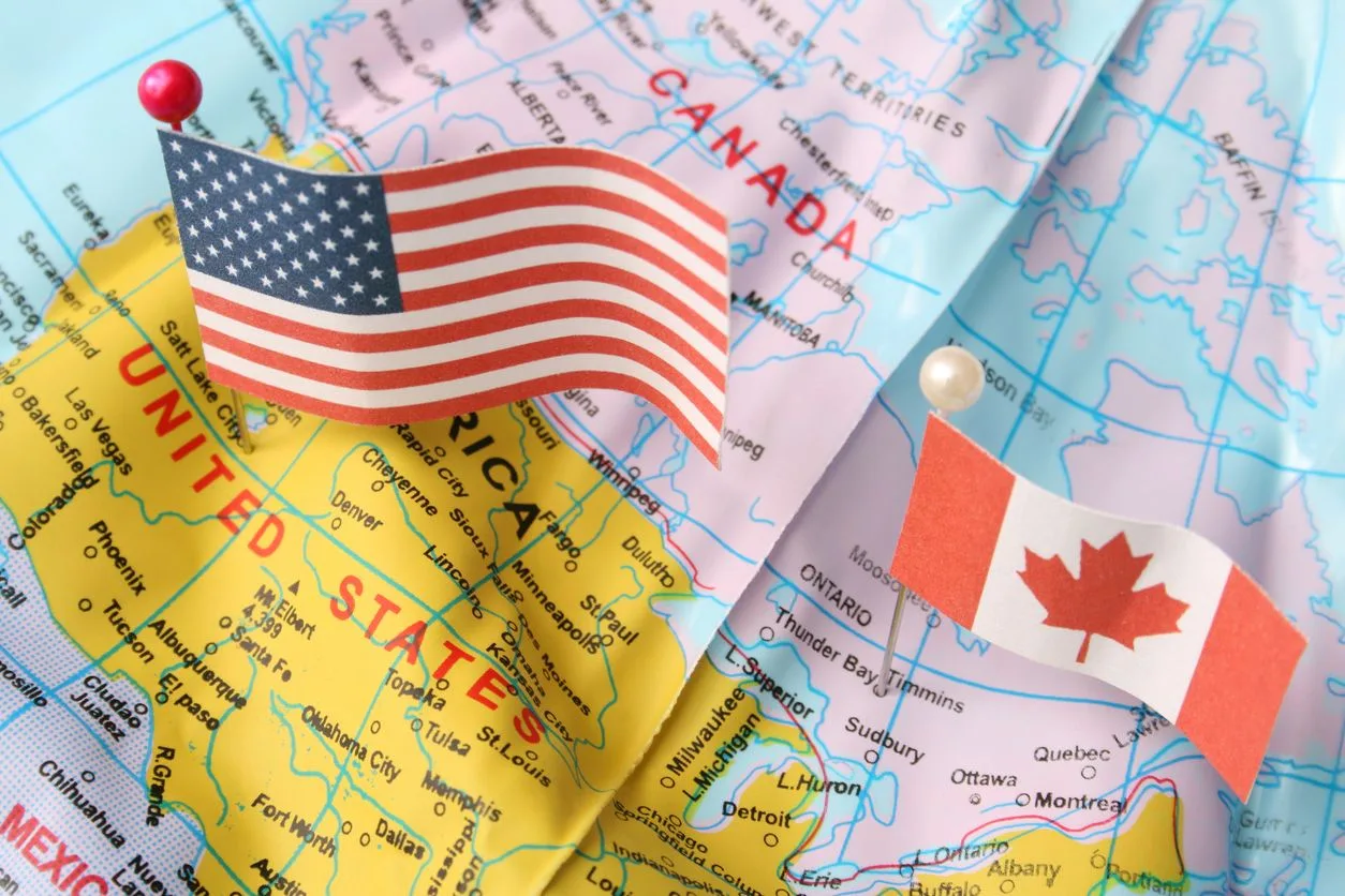 Us canada map flags istock fotografiabasica 157288452