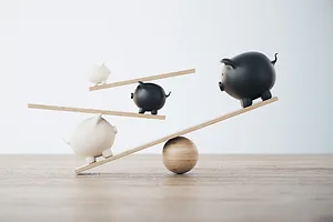 MULTIPLE PIGGY BANKS IN A PRECARIOUS ARRANGEMENT, BALANCED ON INTERDEPENDENT STICKS