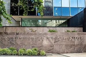 METAL LETTERS SPELLING OUT UNITED STATES COURT OF INTERNATIONAL TRADE ARE AFFIXED TO A MARBLE WALL OUTSIDE A BUILDING
