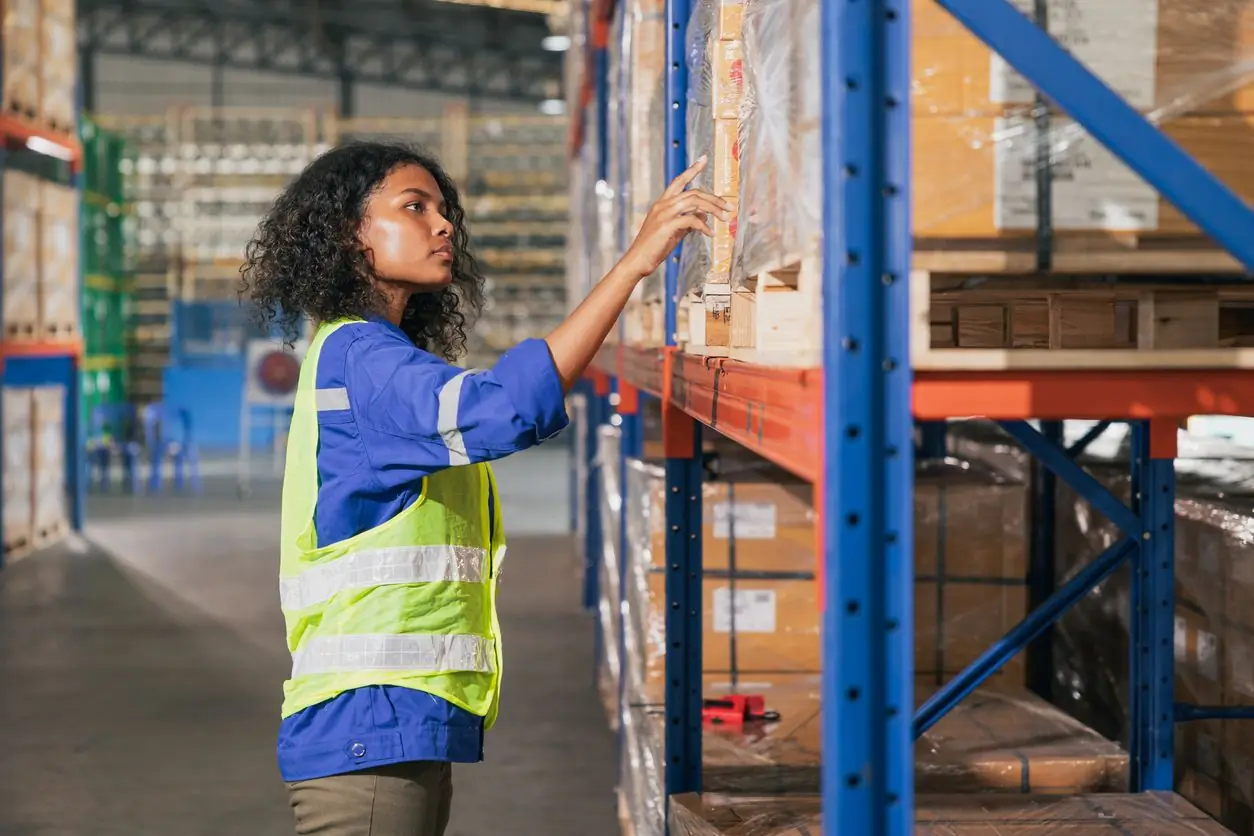 Warehouse worker shelves distribution center istock coffeekai 2241934197