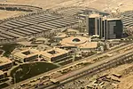 ARAMCO HQ SAUDI ARABIA OIL BLOOMBERG.jpg A LARGE COMPLEX OF BUILDINGS SITS IN THE DESERT